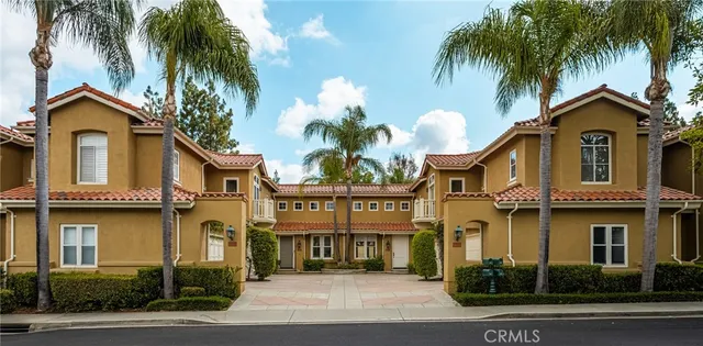 a view of a house with a palm tree