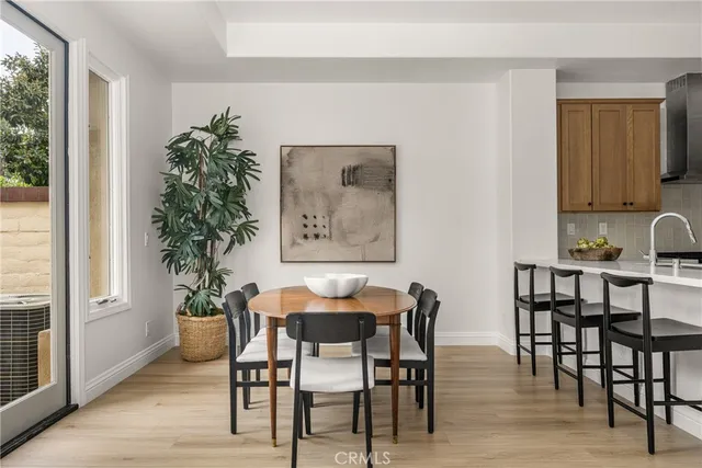 a view of a dining room with furniture and window