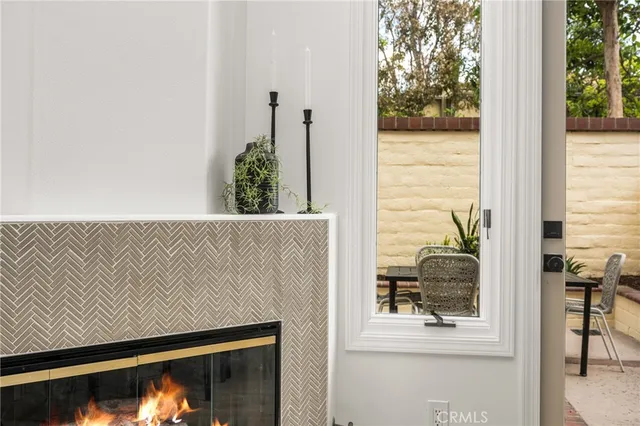 a kitchen with stainless steel appliances a stove a refrigerator white cabinets and a sink