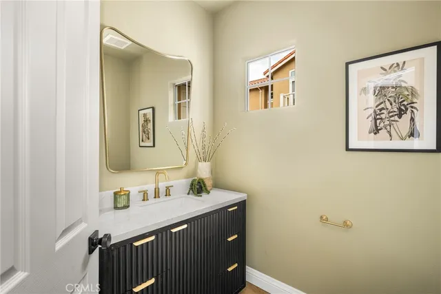 a bedroom with a bed and a wall painting