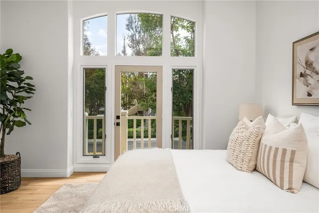 a spacious bedroom with a bed and a dresser