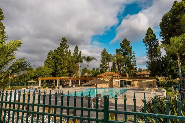 a view of a patio with table and chairs and potted plants