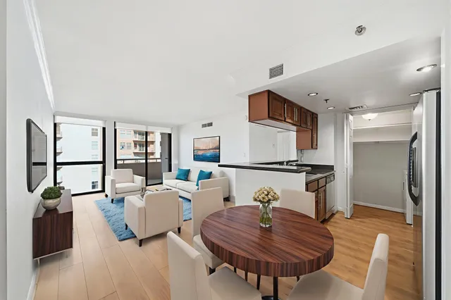 a living room with furniture and a table