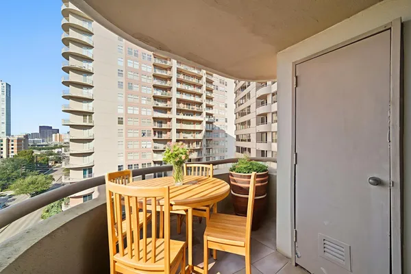 a table and chairs in a balcony