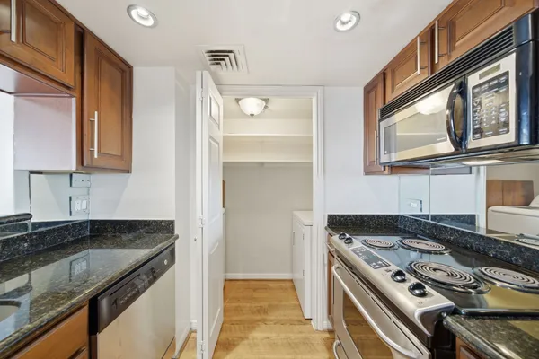 a kitchen that has a stove and a sink