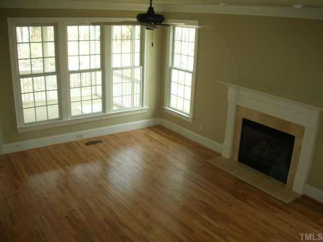 2 Springtree Circle Durham, NC 27712 - Photo 4 of 9 Another view of the family room with beautiful hardwood floors and a gas log fireplace.