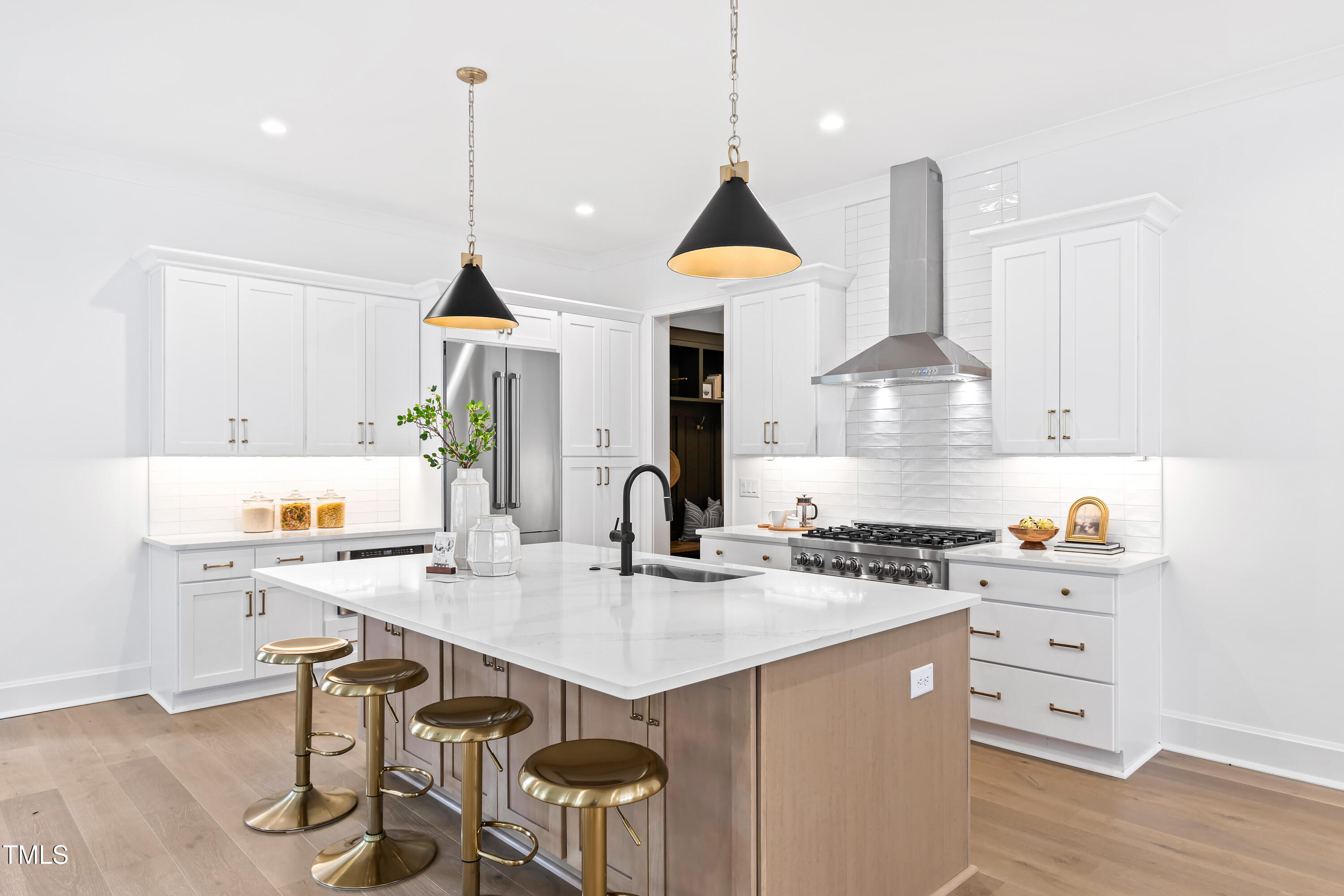 2417 Mayview Road Raleigh, NC 27607 - Photo 11 of 61 a kitchen with a sink a stove a dining table and chairs