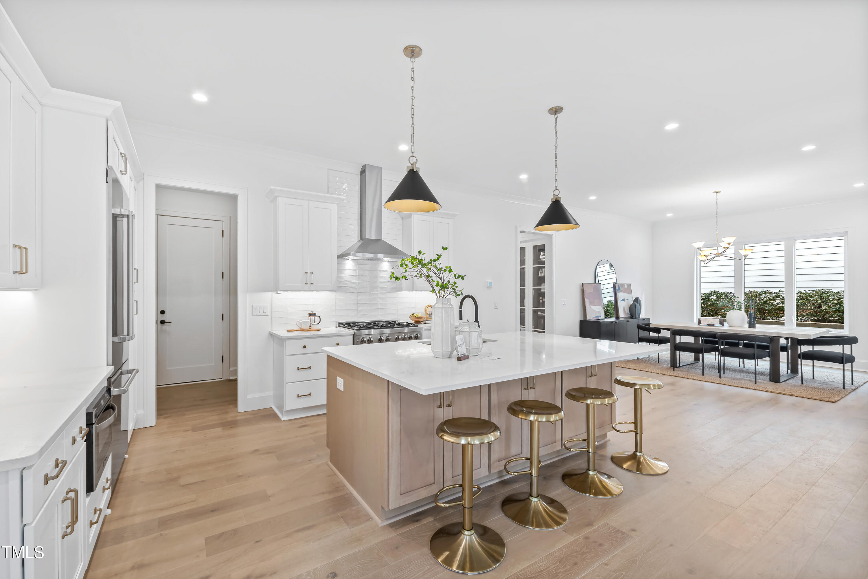 2417 Mayview Road Raleigh, NC 27607 - Photo 12 of 61 a kitchen with stainless steel appliances a stove a sink a oven a table and chairs