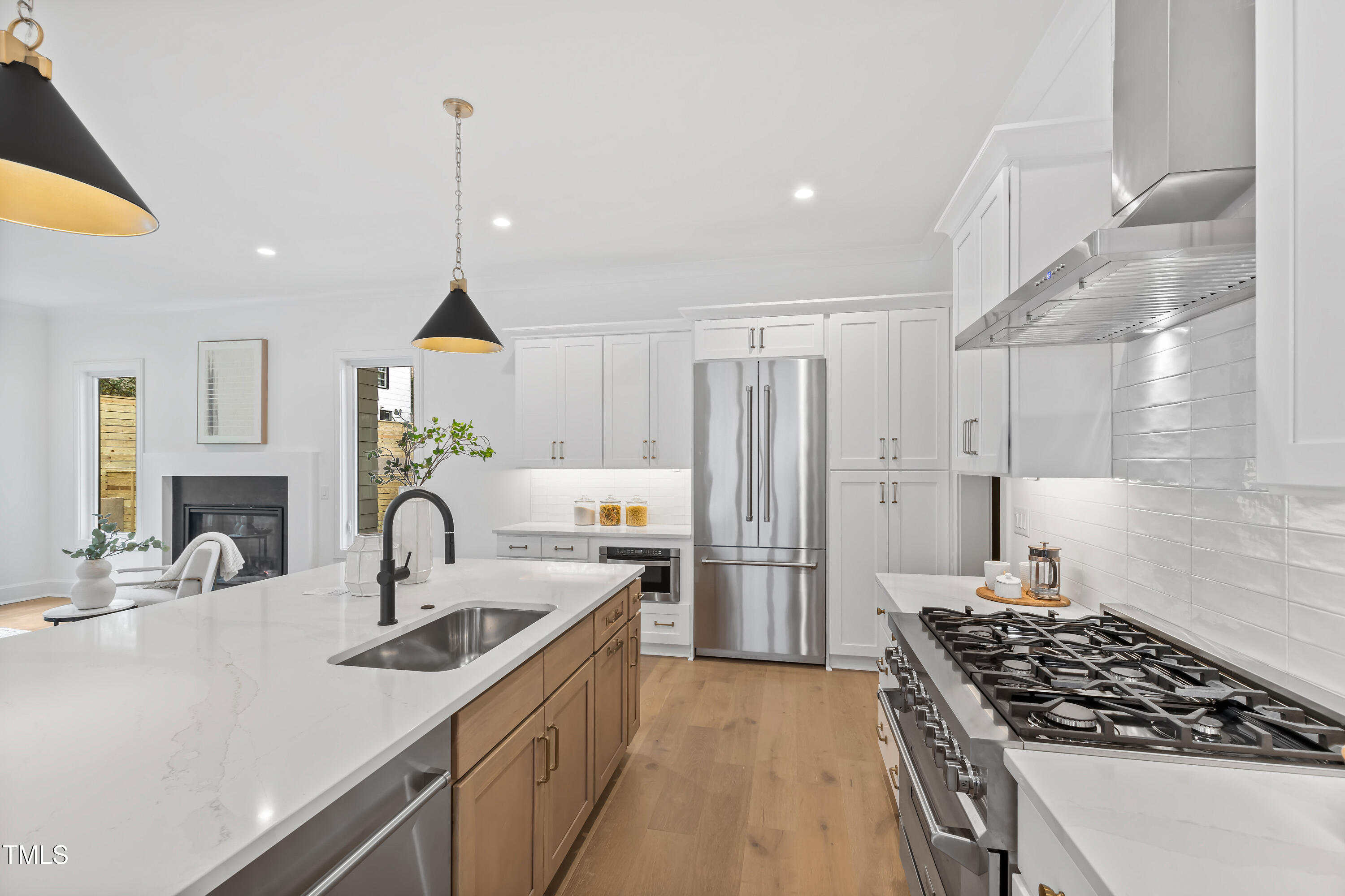 2417 Mayview Road Raleigh, NC 27607 - Photo 15 of 61 a kitchen with a sink stove and refrigerator