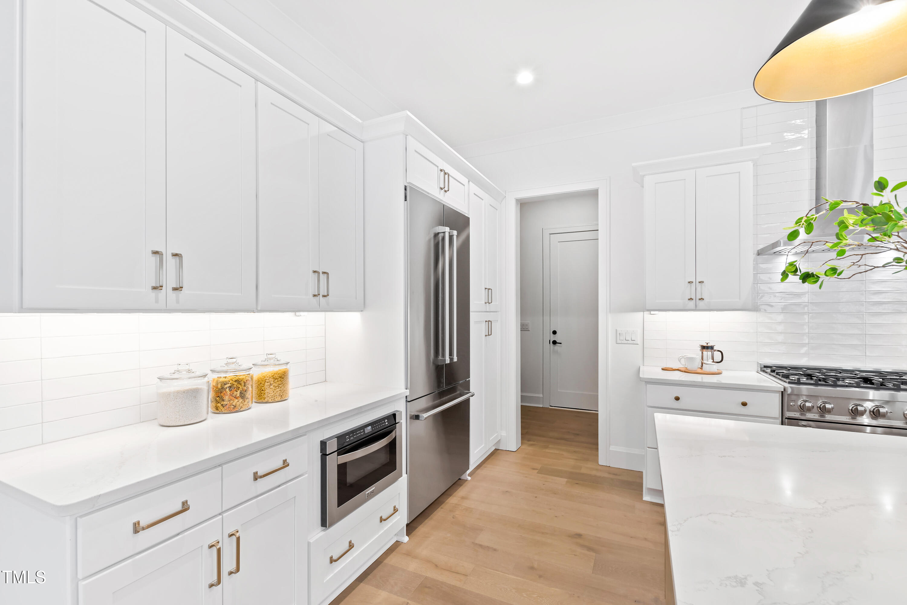 2417 Mayview Road Raleigh, NC 27607 - Photo 17 of 61 a kitchen with stainless steel appliances granite countertop a refrigerator and a stove