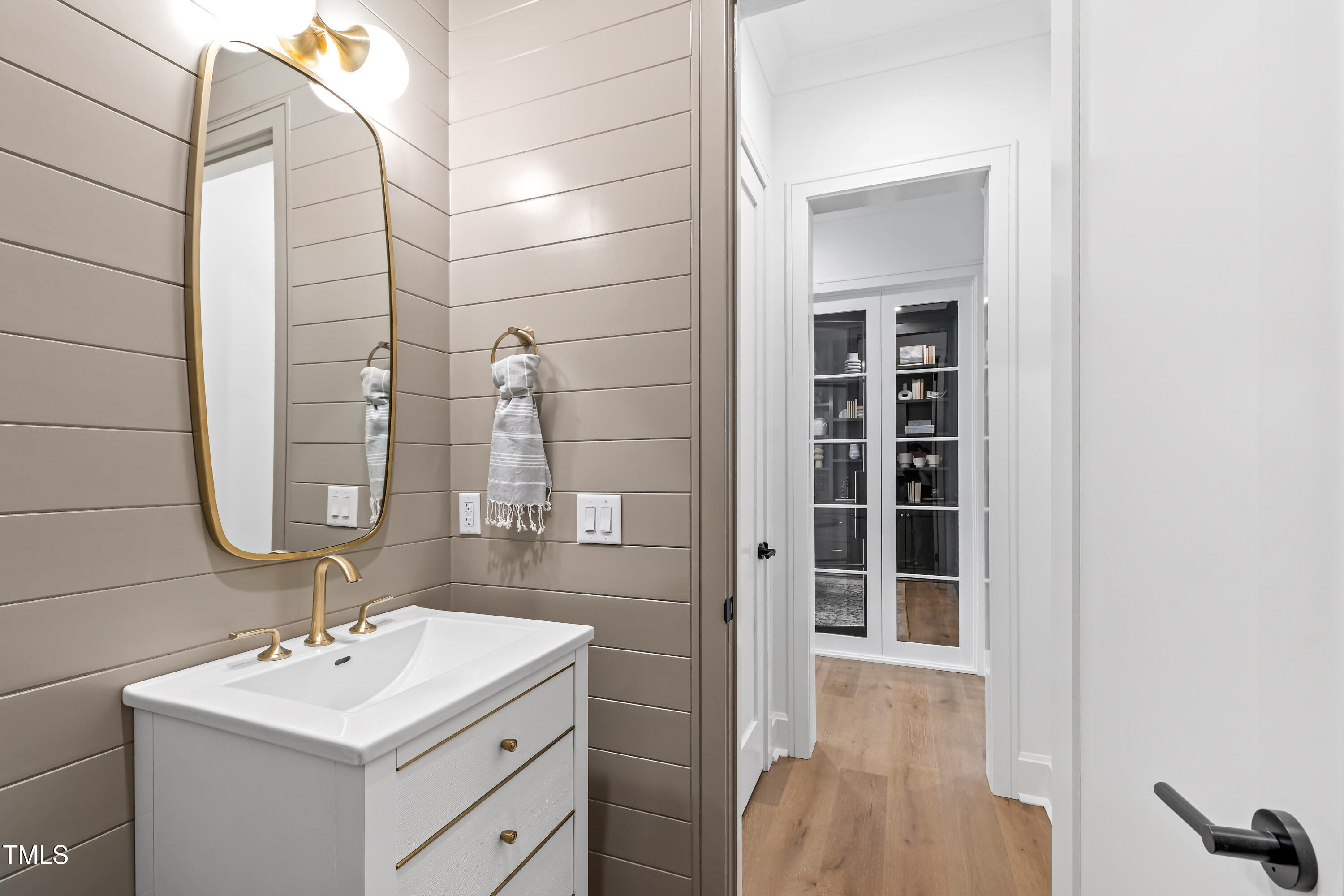 2417 Mayview Road Raleigh, NC 27607 - Photo 24 of 61 a bathroom with a sink and a mirror