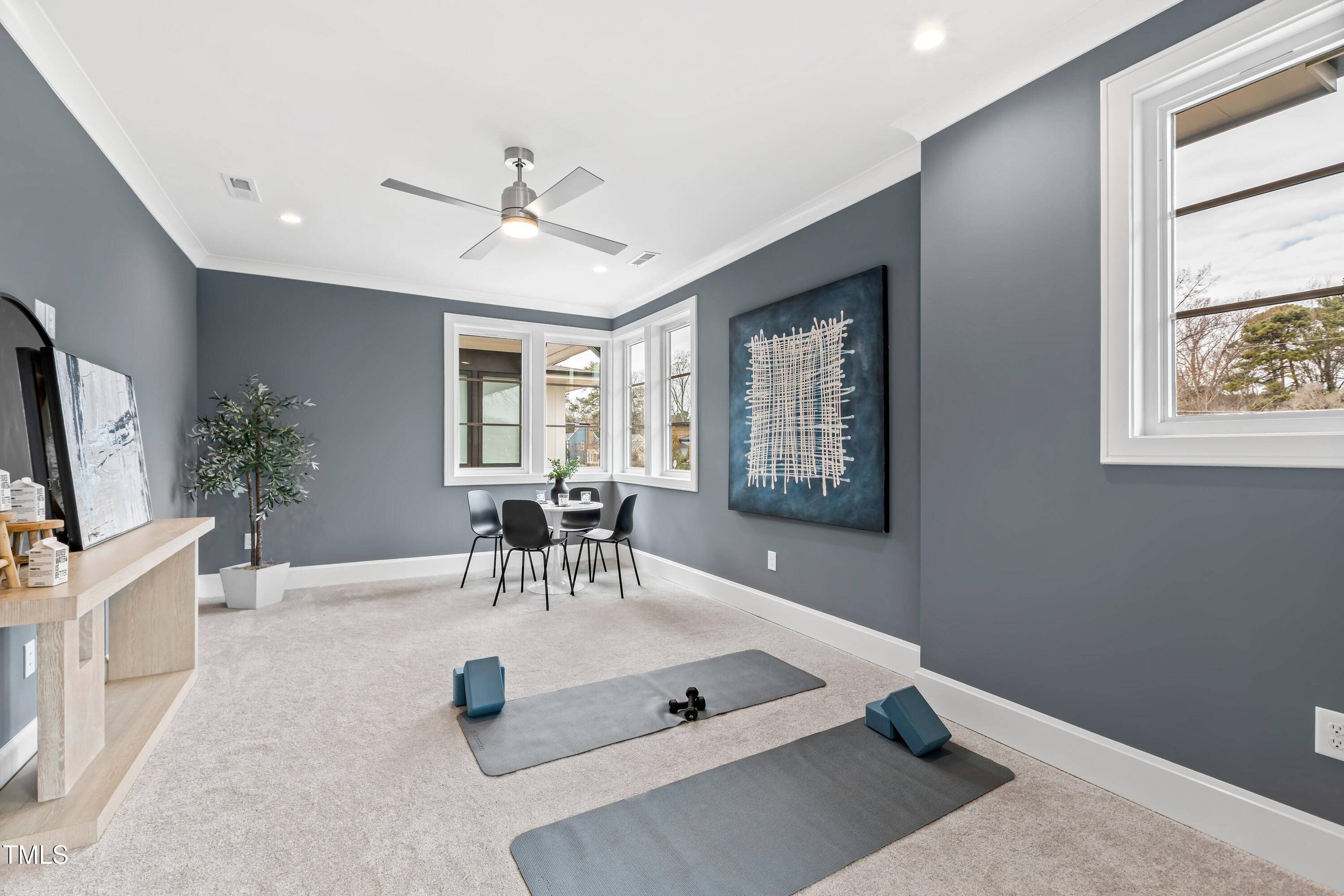 2417 Mayview Road Raleigh, NC 27607 - Photo 28 of 61 a living room with furniture a chandelier and a window