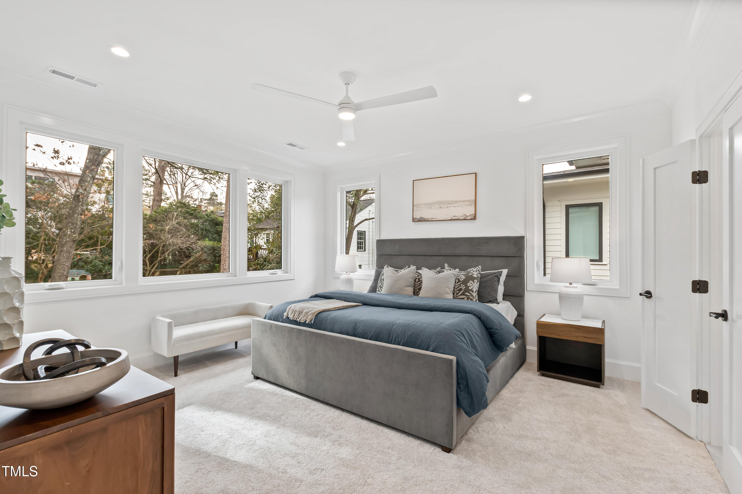 2417 Mayview Road Raleigh, NC 27607 - Photo 31 of 61 a spacious bedroom with a bed and a large window