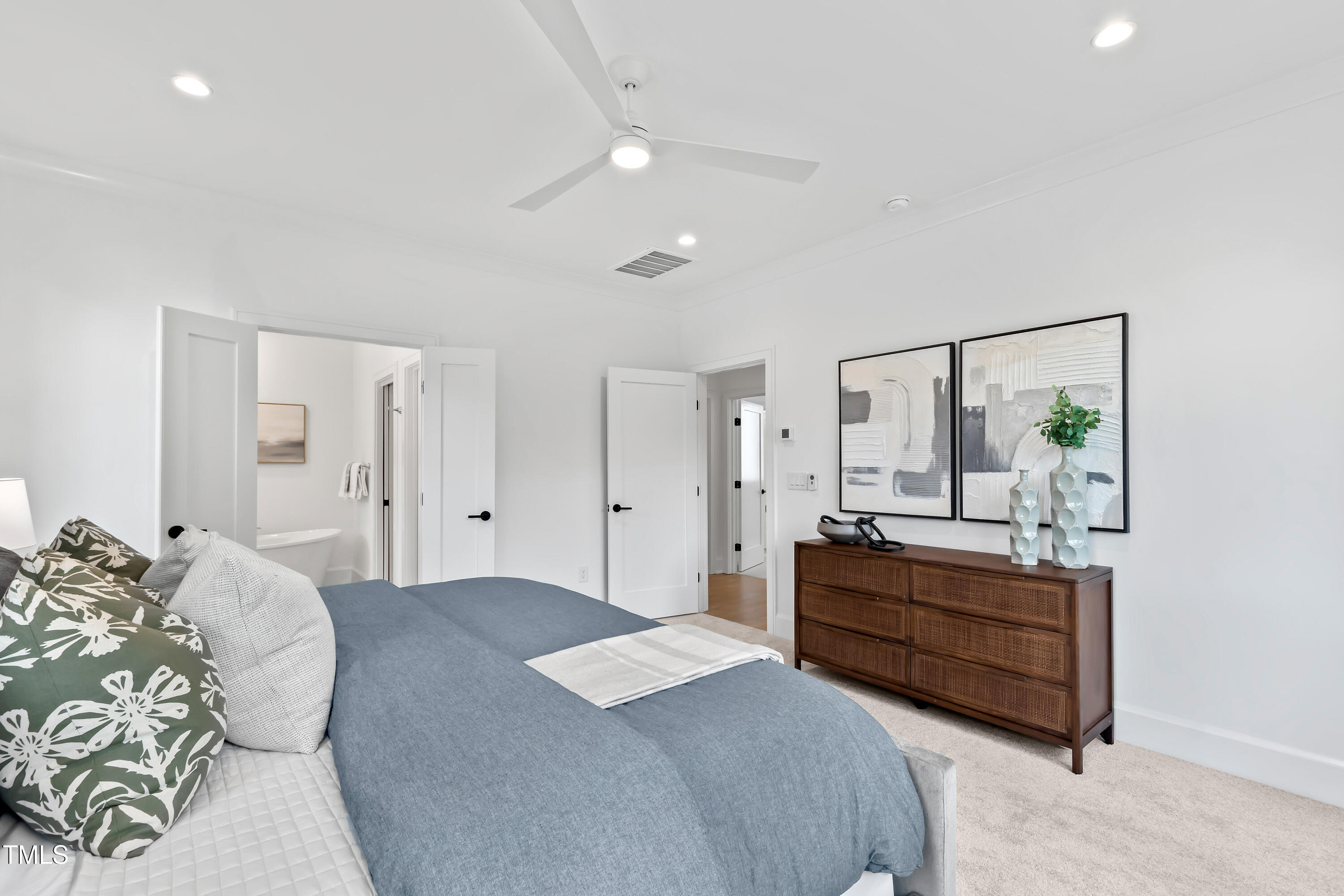 2417 Mayview Road Raleigh, NC 27607 - Photo 32 of 61 a bedroom with a bed and a mirror