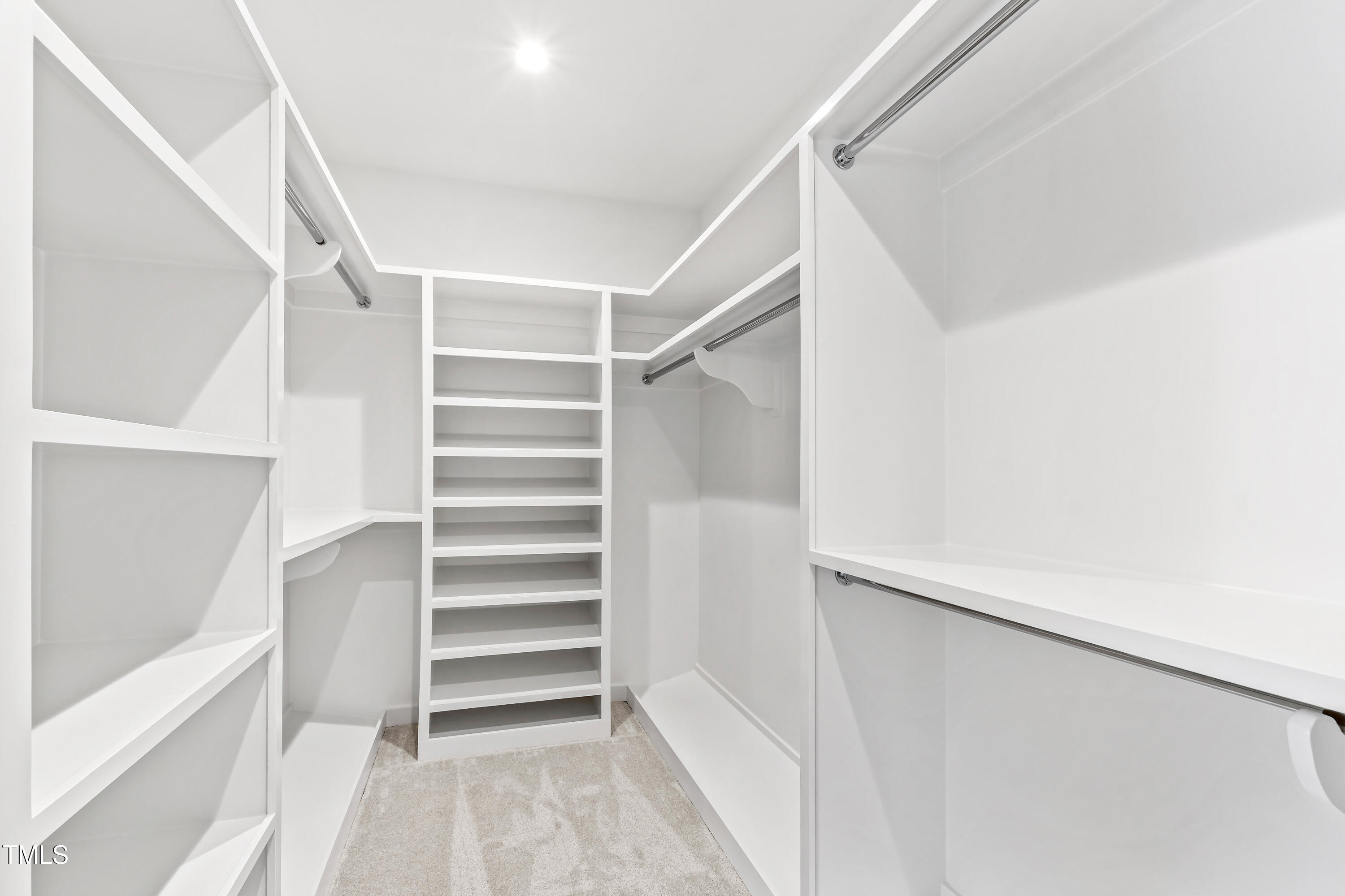 2417 Mayview Road Raleigh, NC 27607 - Photo 38 of 61 a view of walk in closet with empty racks