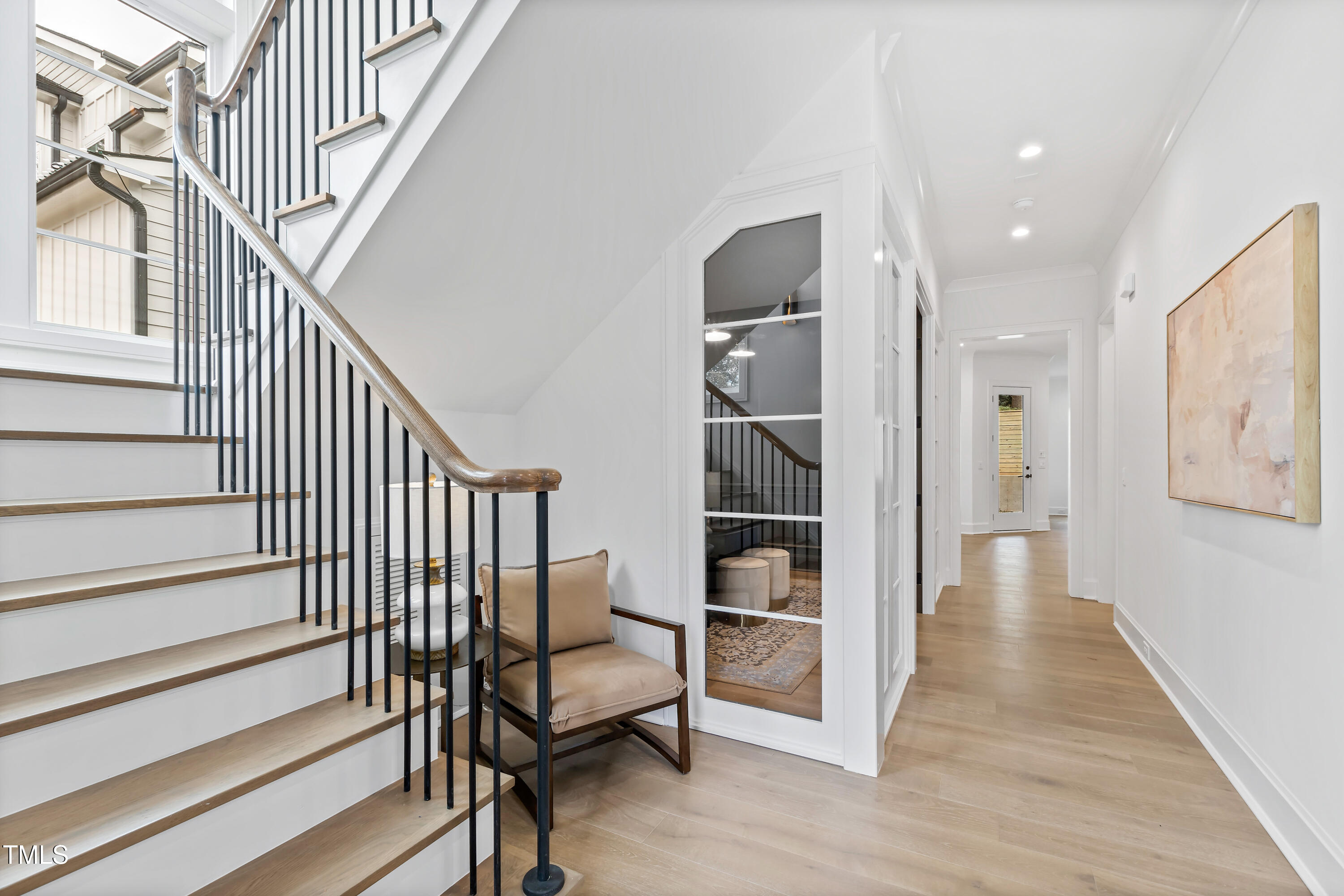 2417 Mayview Road Raleigh, NC 27607 - Photo 3 of 61 a view of entryway with wooden floor and stairs