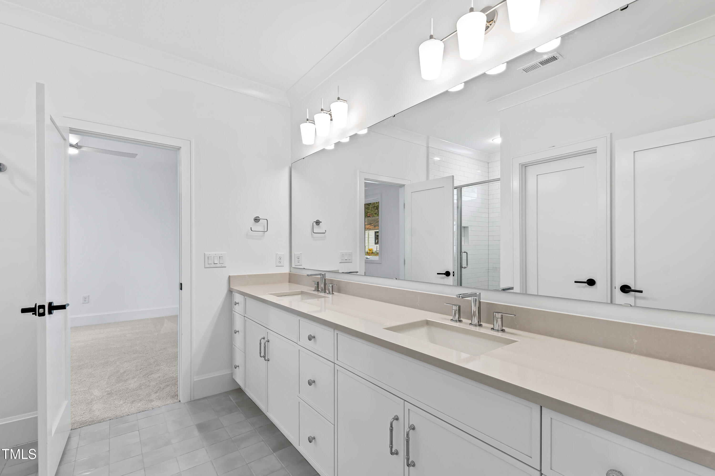 2417 Mayview Road Raleigh, NC 27607 - Photo 41 of 61 a bathroom with a sink a vanity and a mirror