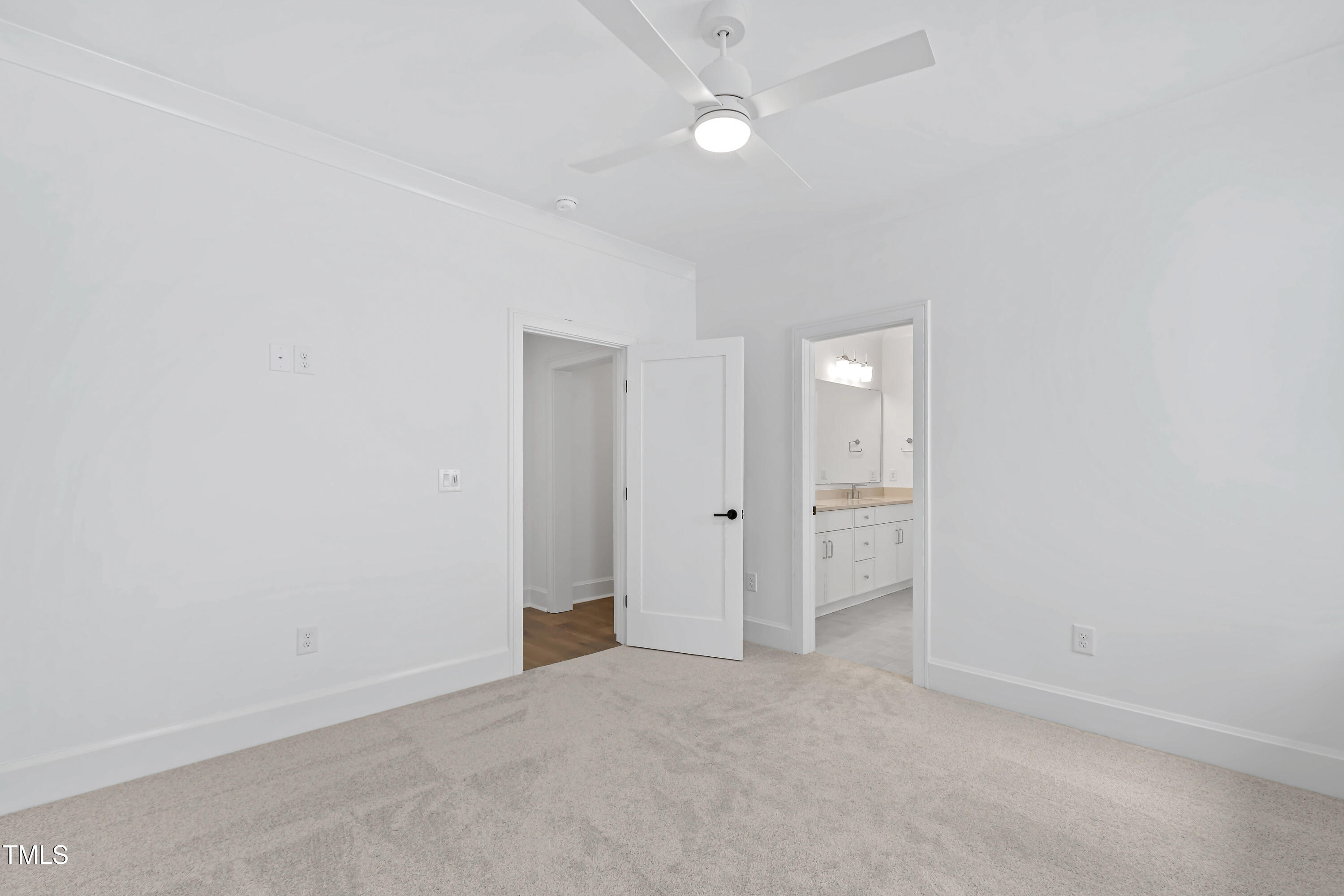2417 Mayview Road Raleigh, NC 27607 - Photo 45 of 61 an empty room with a ceiling fan and closet area