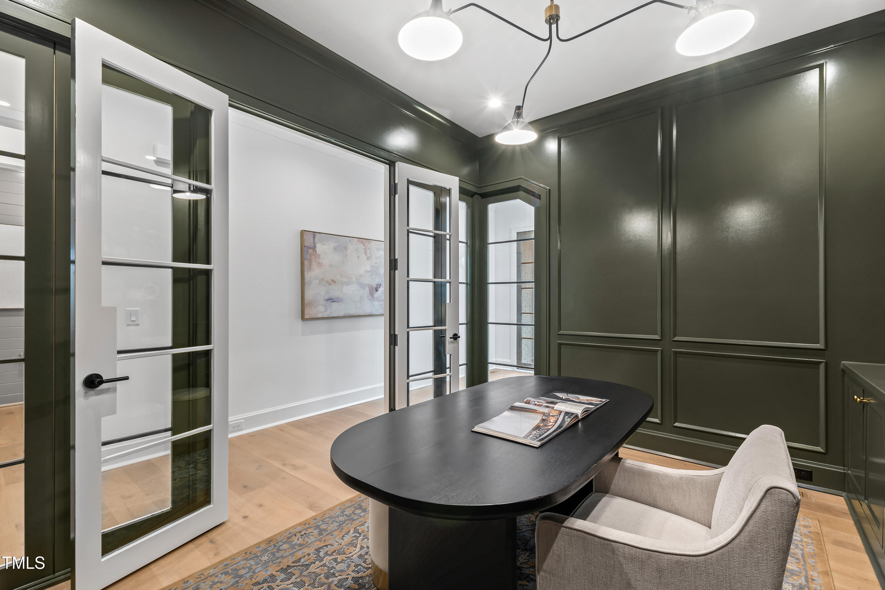 2417 Mayview Road Raleigh, NC 27607 - Photo 4 of 61 a room with furniture and a chandelier