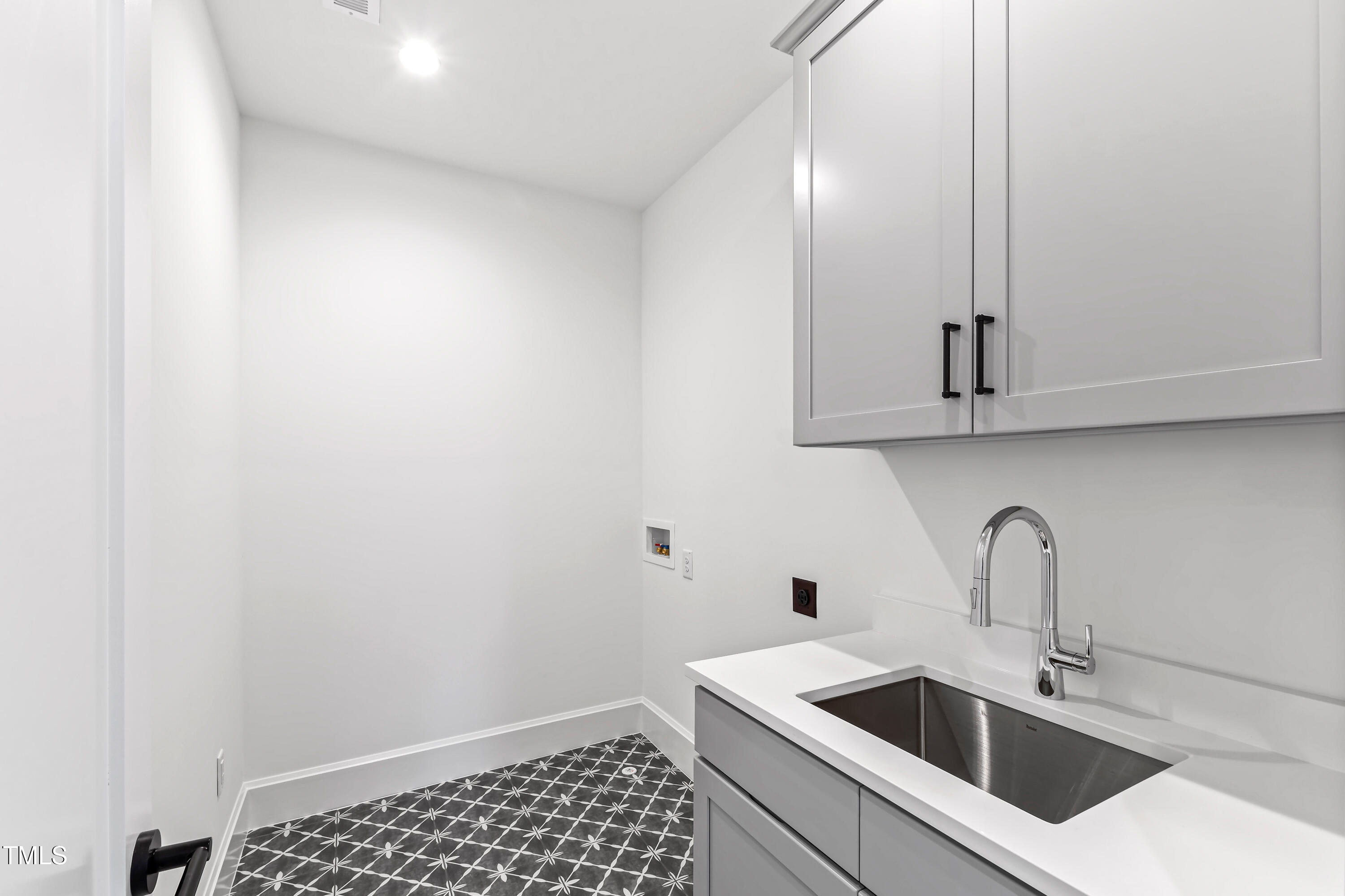 2417 Mayview Road Raleigh, NC 27607 - Photo 50 of 61 a bathroom with a sink and cabinets