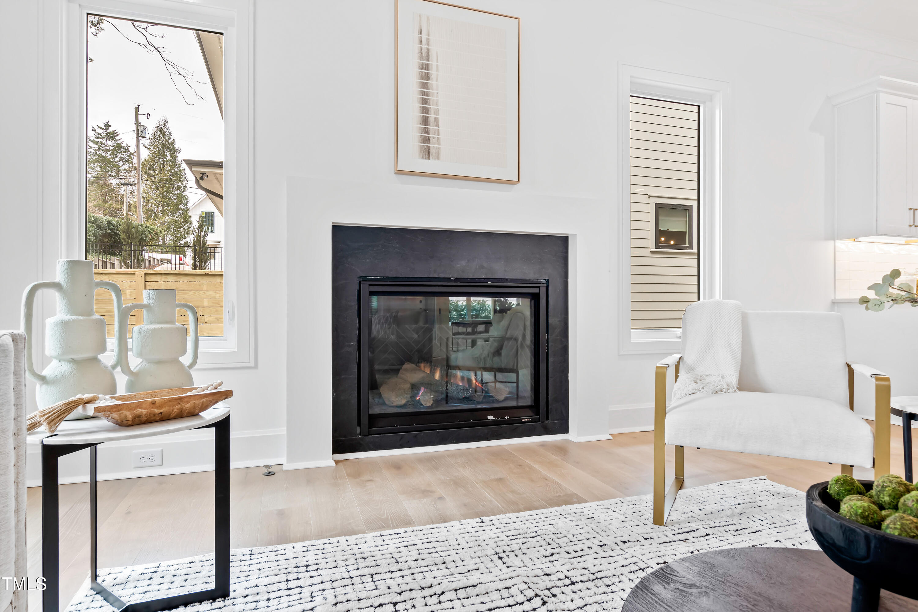2417 Mayview Road Raleigh, NC 27607 - Photo 8 of 61 a living room with furniture a window and a fireplace