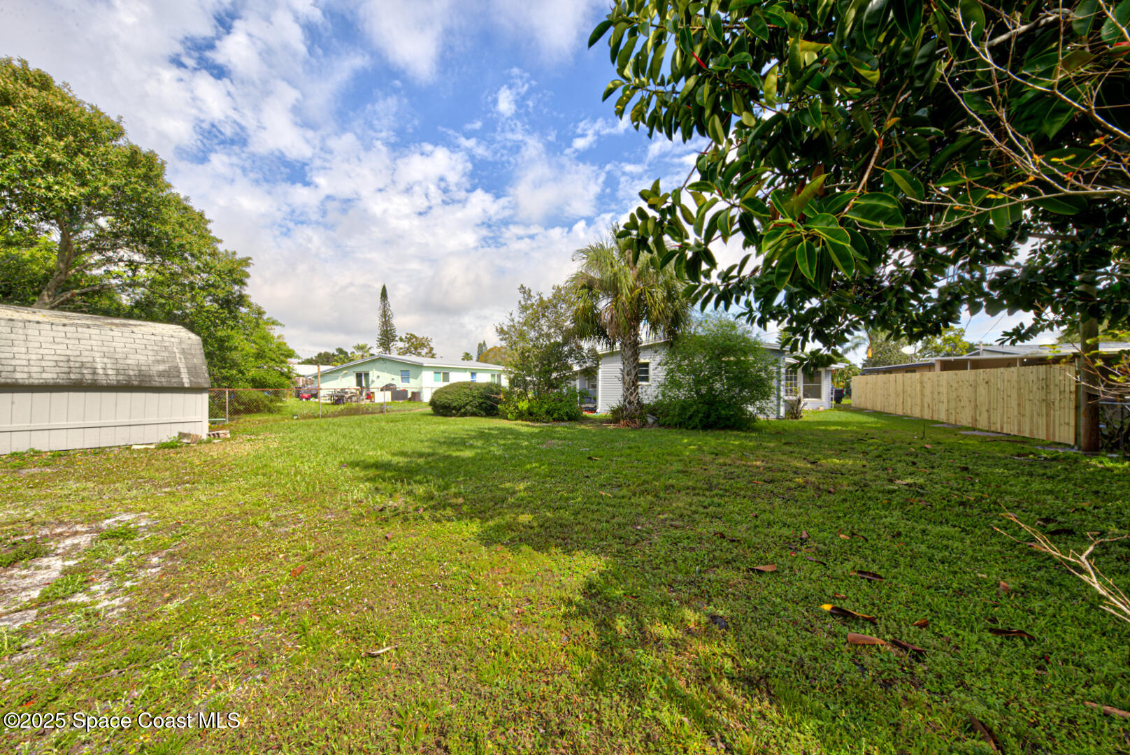 2433 Allan Adale Road Melbourne, FL 32935 - Photo 25 of 29 back of property right