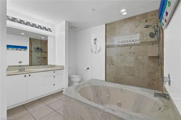 a bathroom with a shower sink and mirror