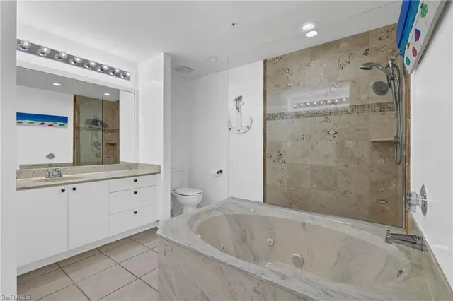 a bathroom with a shower sink and mirror