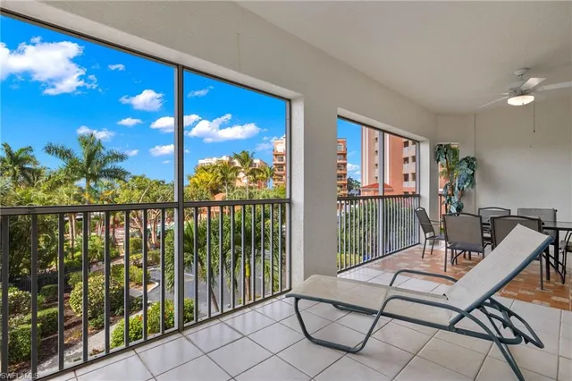 a view of ocean with a palm tree