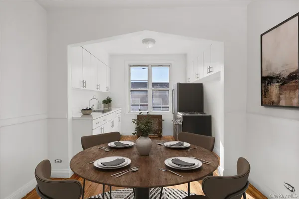 a view of a dining room with furniture and wooden floor