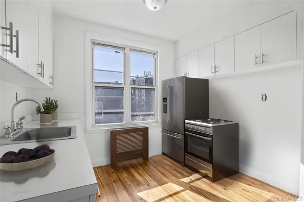 a kitchen with cabinets and a stove