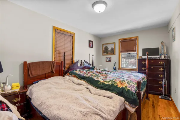 a bed room with a bed and a television