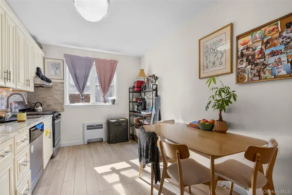 a kitchen with a table and chairs in it