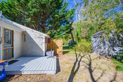 a view of backyard with a patio and outdoor seating