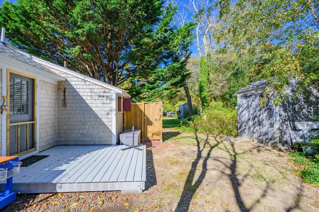 a view of backyard with a patio and outdoor seating