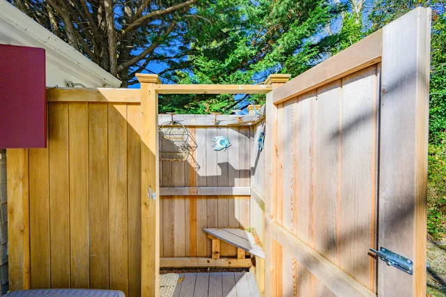 a view of balcony with wooden fence