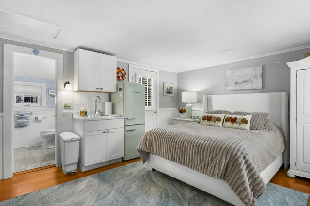 a bedroom with a bed and a cabinets