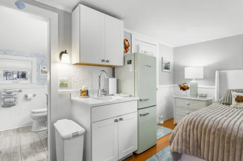 a bedroom with a bed and a cabinets