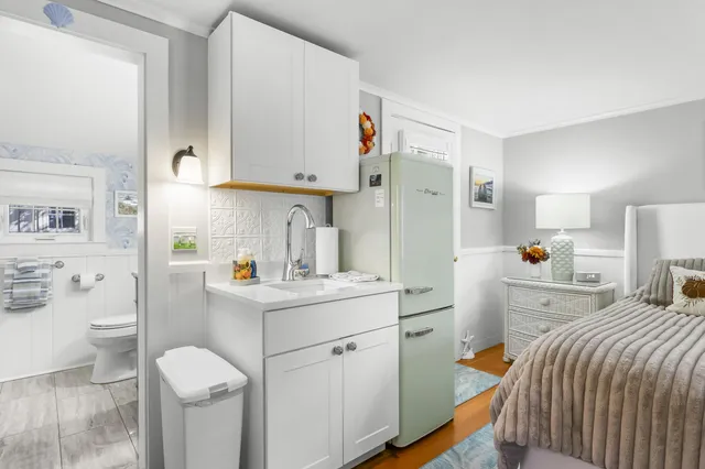 a bedroom with a bed and a cabinets