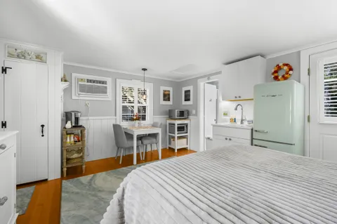 a bedroom with a bed and a cabinets