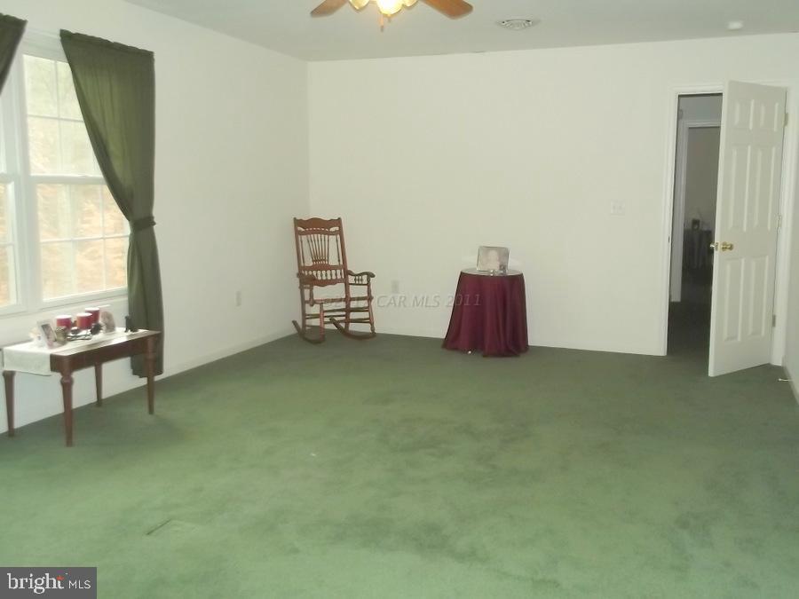 10665 Clarence Barnes Road Princess Anne, MD 21853 - Photo 16 of 21 a view of livingroom with furniture and windows