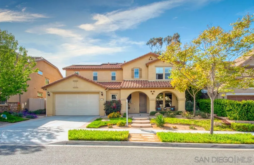 a house with swimming pool in front of it