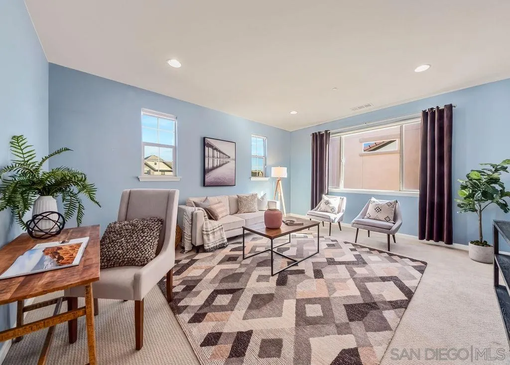 17568 Ralphs Ranch Road San Diego, CA 92127 - Photo 15 of 25 a living room with furniture and a potted plant