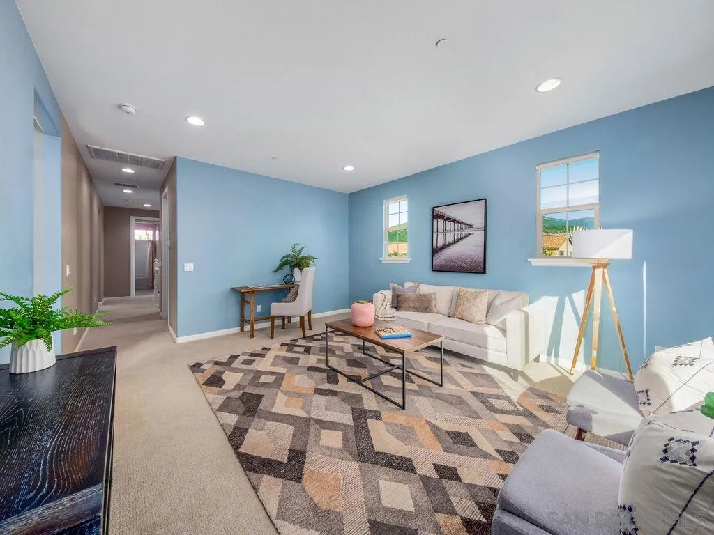 17568 Ralphs Ranch Road San Diego, CA 92127 - Photo 16 of 25 a bedroom with a large bed and a potted plant