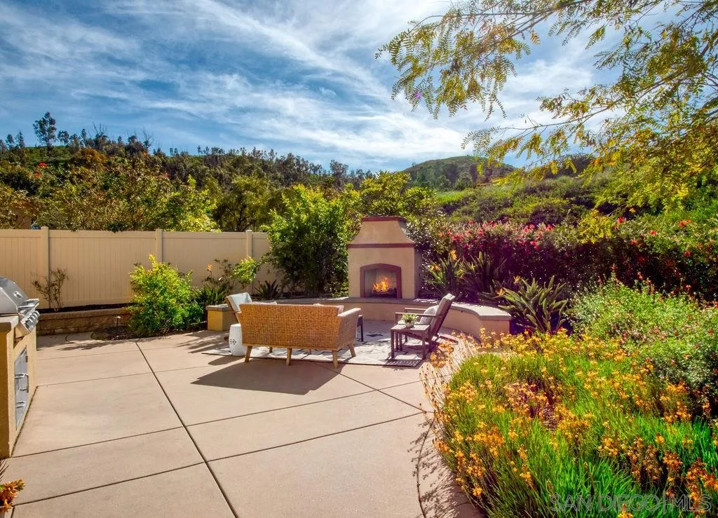 17568 Ralphs Ranch Road San Diego, CA 92127 - Photo 21 of 25 a terrace with outdoor seating and trees