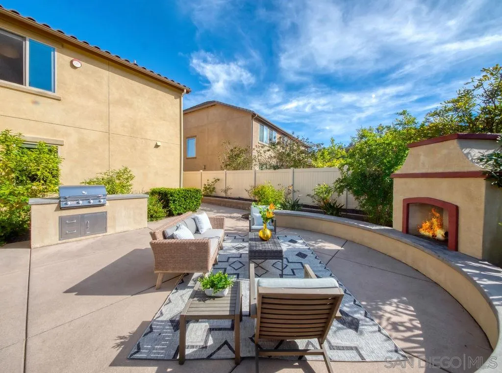 17568 Ralphs Ranch Road San Diego, CA 92127 - Photo 22 of 25 a view of a patio with couches chairs and a fire pit