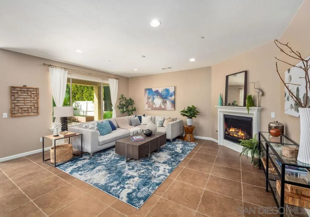 17568 Ralphs Ranch Road San Diego, CA 92127 - Photo 3 of 25 a living room with furniture and a fireplace