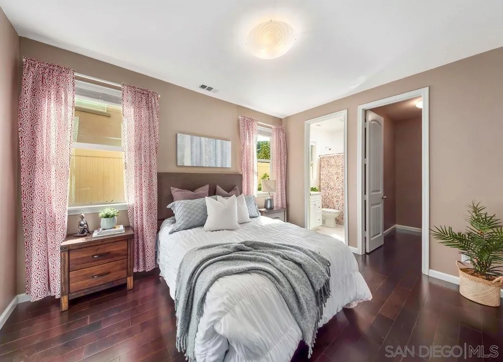 17568 Ralphs Ranch Road San Diego, CA 92127 - Photo 8 of 25 a bedroom with a bed and a potted plant