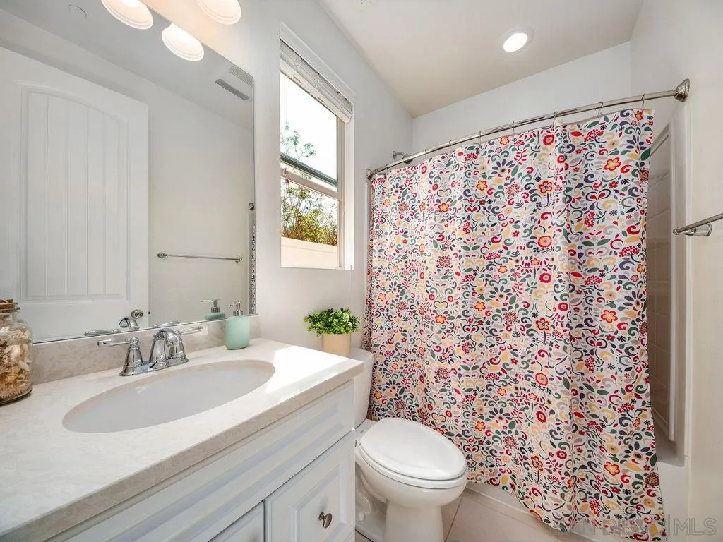 17568 Ralphs Ranch Road San Diego, CA 92127 - Photo 9 of 25 a bathroom with a sink toilet and shower