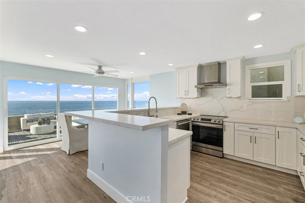 35261 Beach Road Dana Point, CA 92624 - Photo 11 of 45 a kitchen with stainless steel appliances granite countertop a sink stove and refrigerator